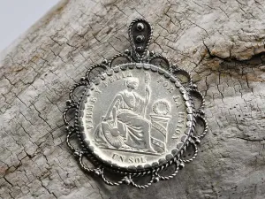 Silver pendant with antique coin 