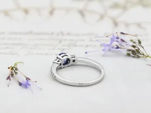 Anillo de Oro Blanco con Diamantes y Tanzanita