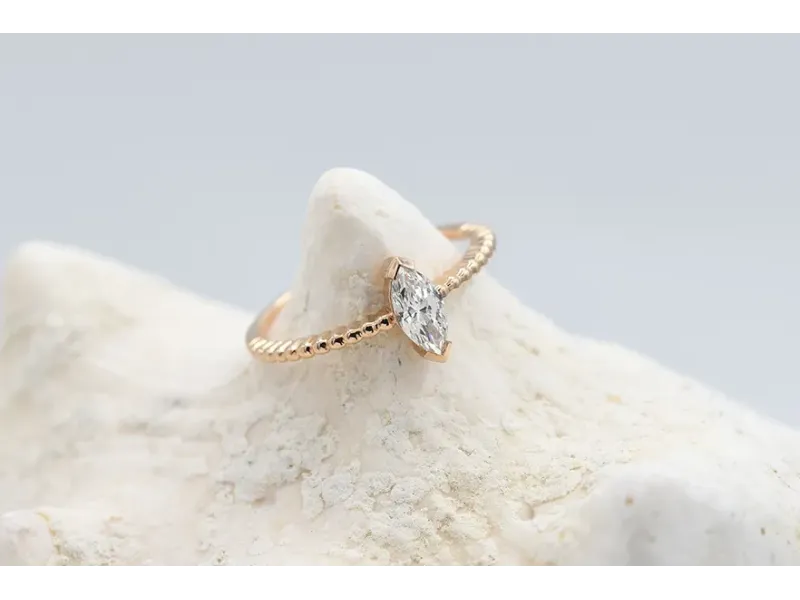 Rose Gold Solitaire Ring with Marquise-Cut Diamond