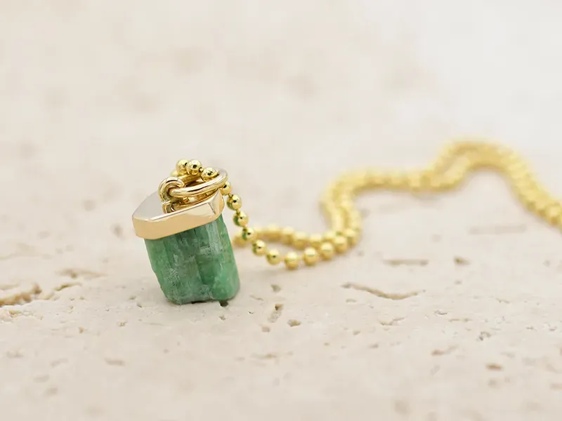Pendant with raw Emerald
