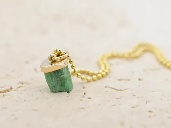 Pendant with raw Emerald