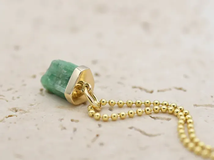 Pendant with raw Emerald