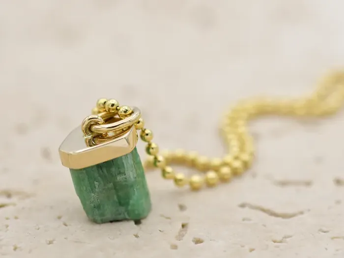 Pendant with raw Emerald
