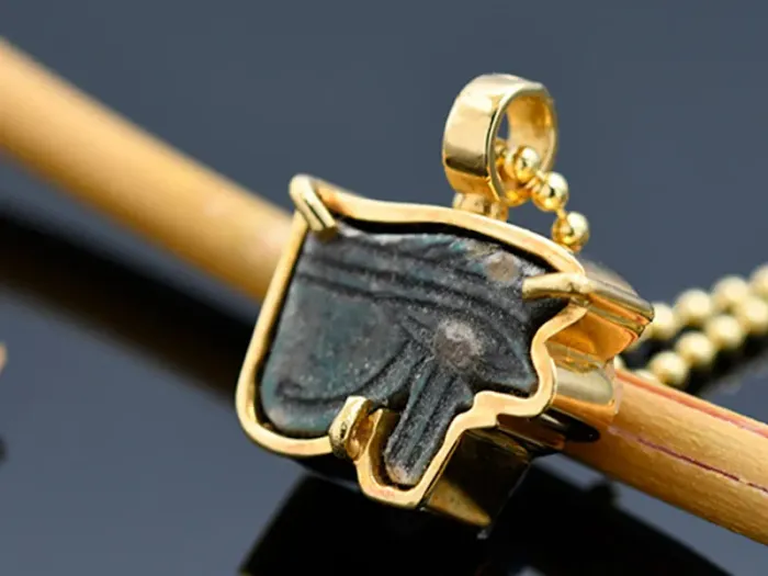 Gold Pendant with Ancient Egyptian Amulet. Eye of Horus