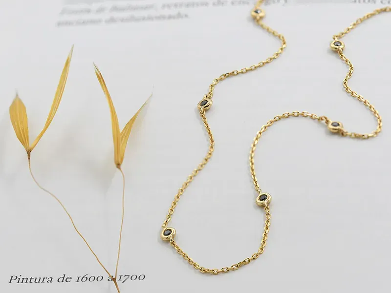 Gold choker with black diamonds